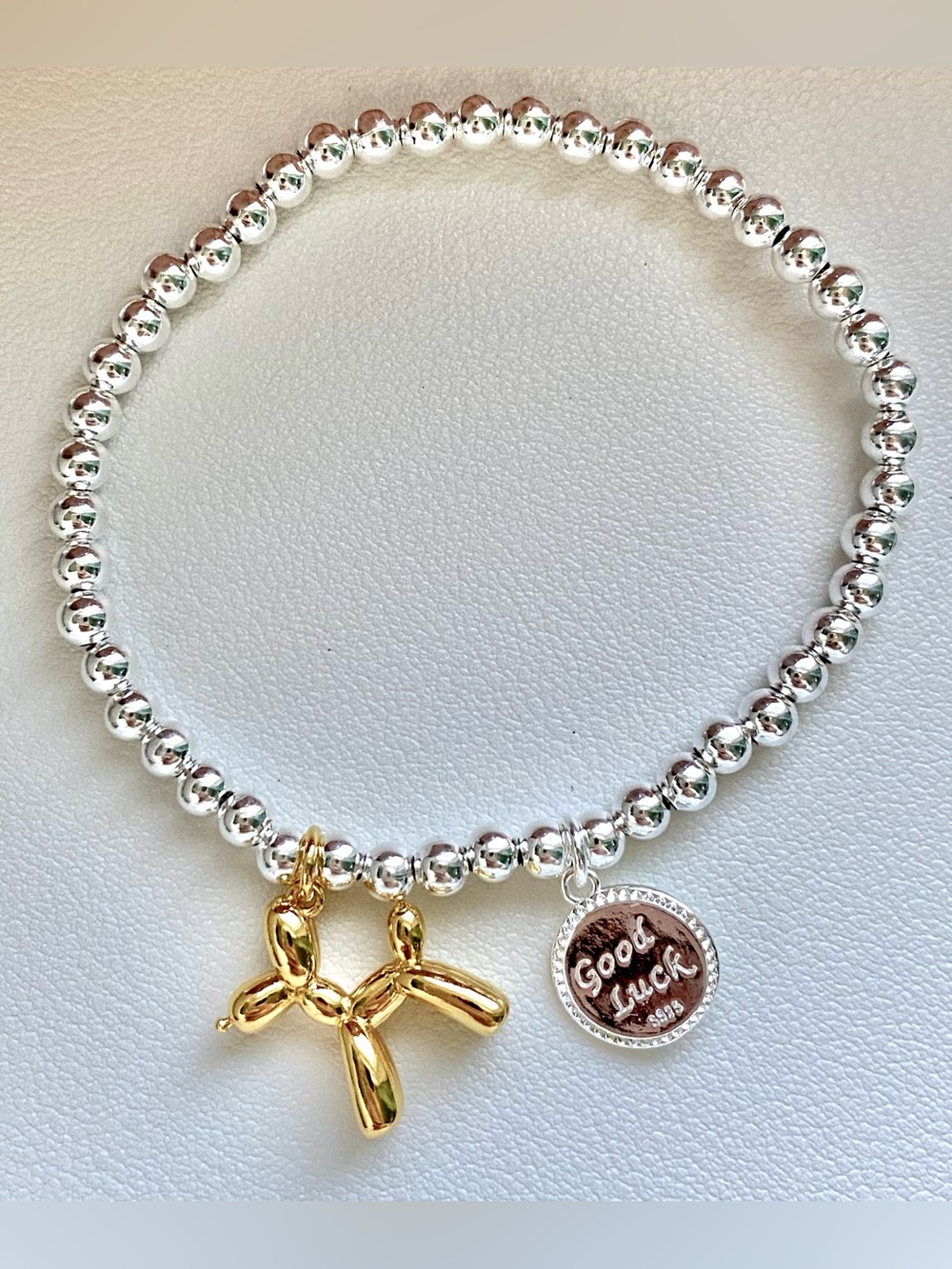 Silver Beaded Bracelet with Gold Balloon Dog Charm and 'Good Luck' Disc
